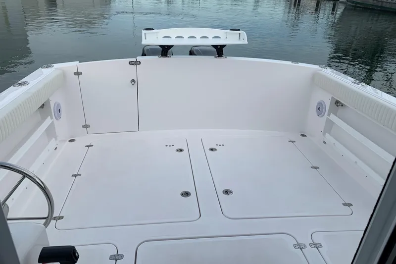 Slide: The Image of 2026 SeaSport Offshore 3000 boat deck, spacious and clean, docked by calm waters. - 8