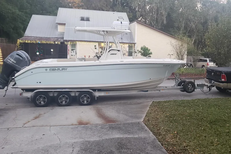 Slide: The Image of 2017 Century 2600 Center Console boat on trailer in residential driveway. - 12
