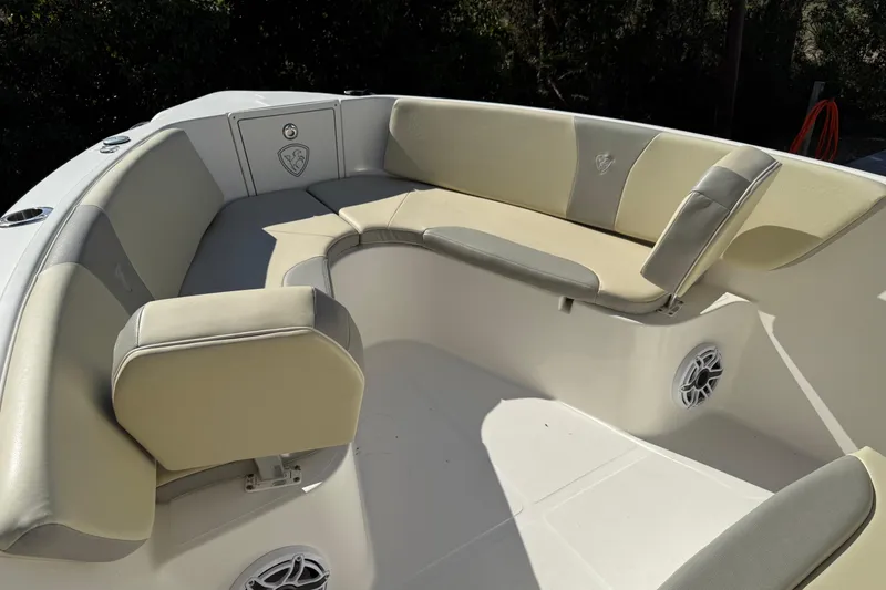 Slide: The Image of 2017 Century 2600 Center Console boat with beige seating and speaker system. - 9