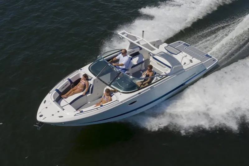 Slide: The Image of Manufacturer Provided Image: 2023 Chaparral 287 SSX speedboat cruising on water with passengers. - 12