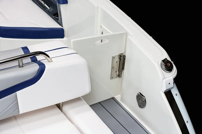 Slide: The Image of Manufacturer Provided Image: 2023 Chaparral 287 SSX boat interior, featuring white and blue seating with stainless steel accents. - 31