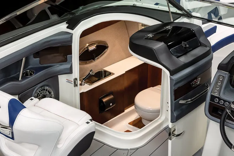 Slide: The Image of Manufacturer Provided Image: 2023 Chaparral 287 SSX boat interior with a compact bathroom. - 34
