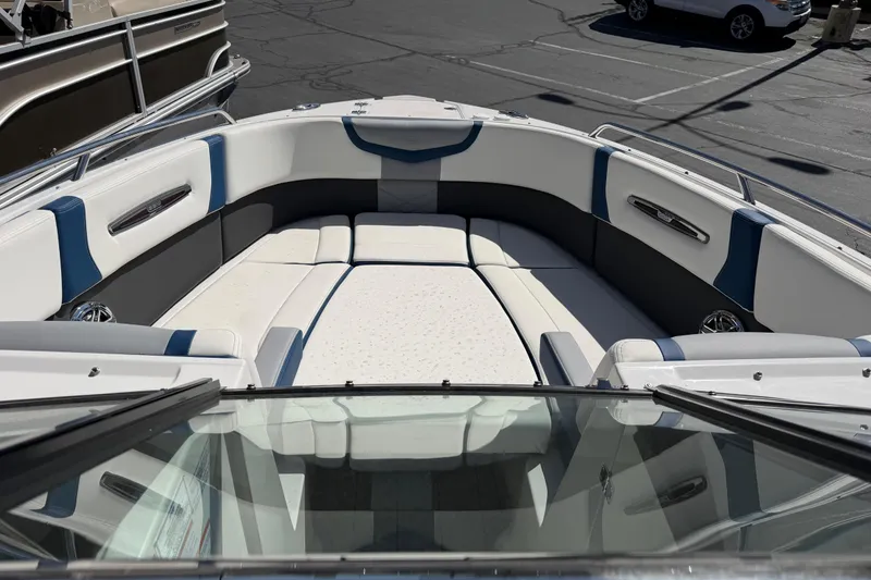 Slide: The Image of 2023 Chaparral 287 SSX boat interior with spacious seating and modern design. - 7