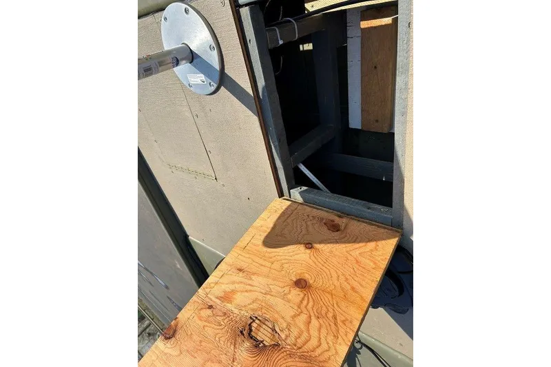 Slide: The Image of Wooden platform attached to a 2024 Lund UR1448MTD boat, showcasing construction details. - 17