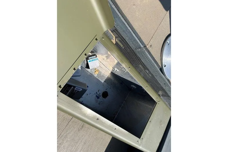 Slide: The Image of 2024 Lund UR1448MTD boat interior with open compartment and visible wiring. - 8