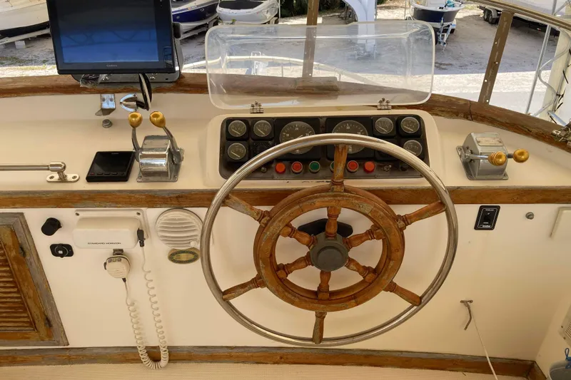 Slide: The Image of Helm of 1988 Albin 43 Trawler with wooden wheel and navigation instruments. - 10