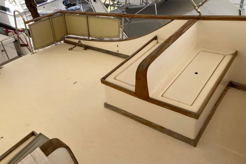 Slide: The Image of 1988 Albin 43 Trawler deck with seating and railing, showcasing classic nautical design. - 11