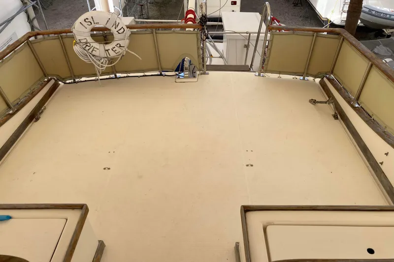 Slide: The Image of Deck of 1988 Albin 43 Trawler with life preserver, spacious and clean layout. - 13