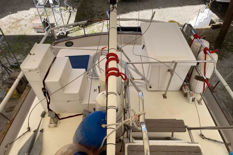 Slide: The Image of 1988 Albin 43 Trawler deck view with seating, storage, and safety equipment. - 15