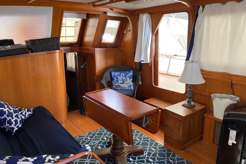 Slide: The Image of Interior of 1988 Albin 43 Trawler with wooden furnishings and nautical decor. - 18
