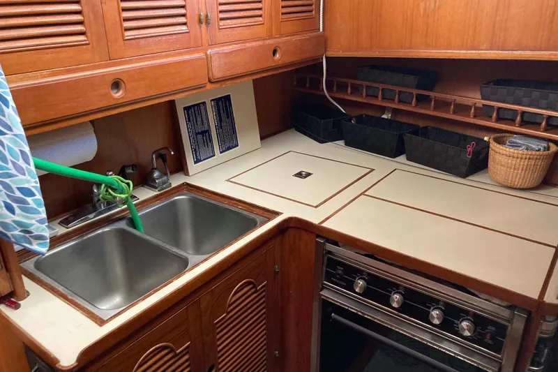 Slide: The Image of Galley kitchen in 1988 Albin 43 Trawler with double sink and stove. - 23