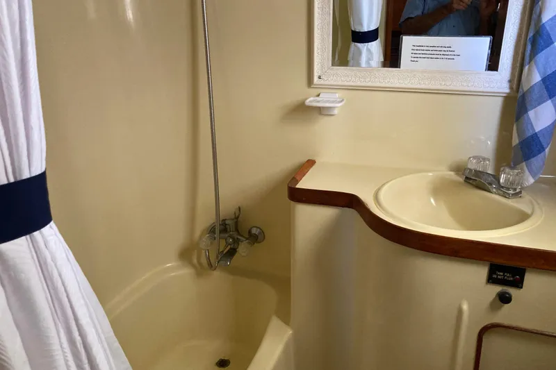 Slide: The Image of Bathroom interior of 1988 Albin 43 Trawler with shower and sink. - 31