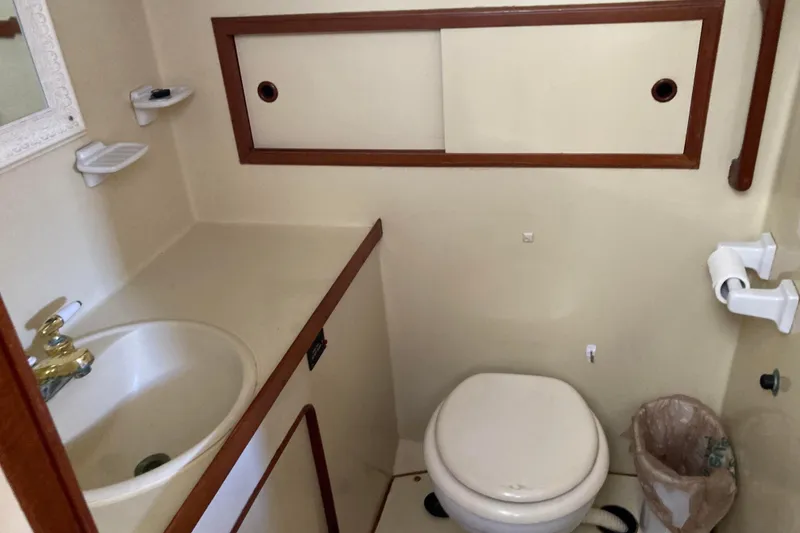 Slide: The Image of Bathroom interior of 1988 Albin 43 Trawler with sink and toilet. - 37