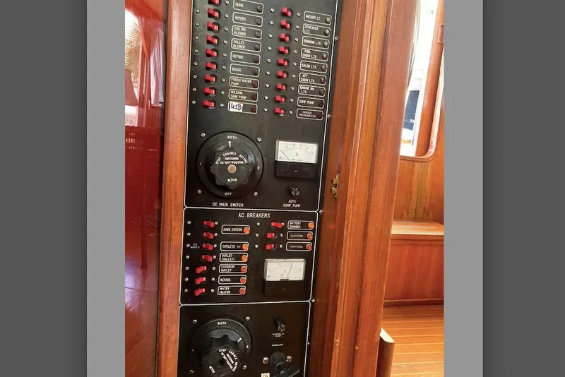 Slide: The Image of Electrical panel on a 1988 Albin 43 Trawler, featuring switches and gauges. - 40