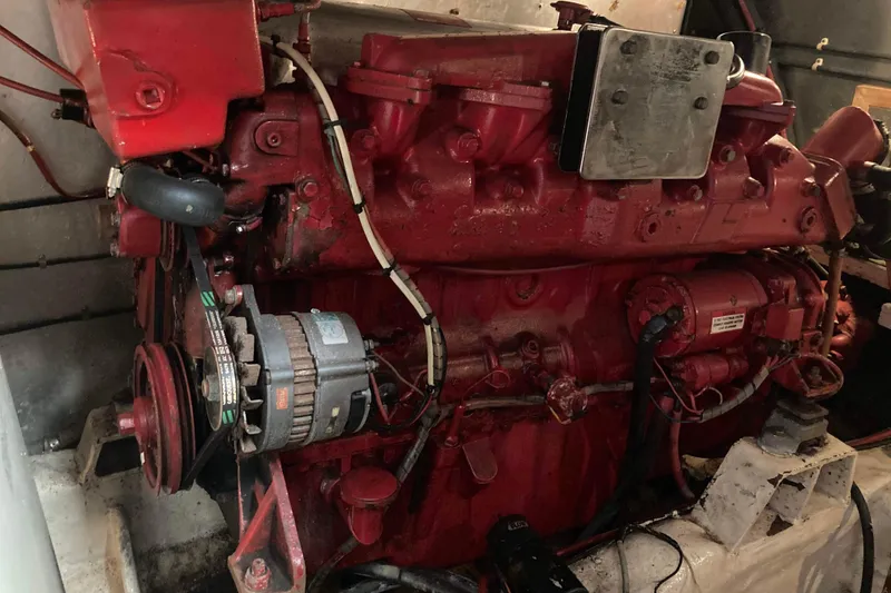 Slide: The Image of Engine of a 1988 Albin 43 Trawler, featuring red components and visible wiring. - 41