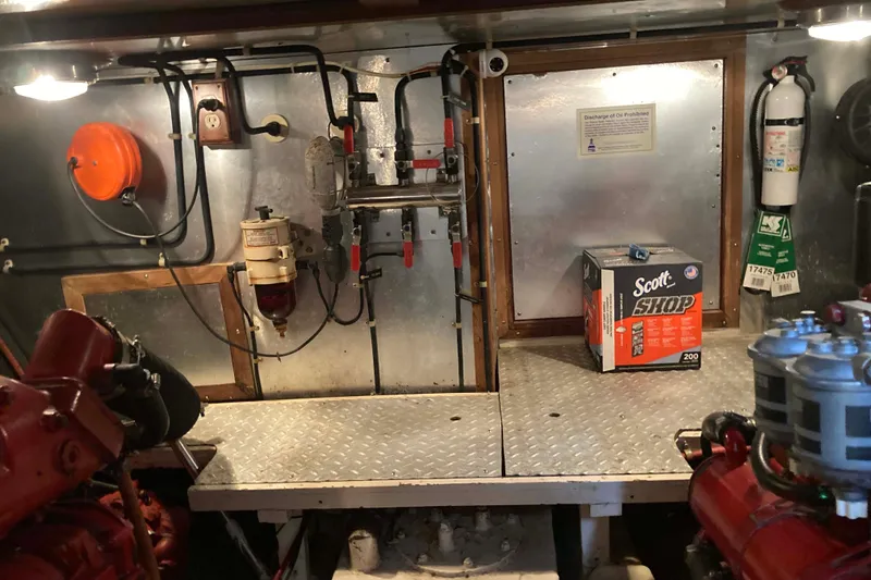 Slide: The Image of Engine room of a 1988 Albin 43 Trawler with tools and equipment. - 43