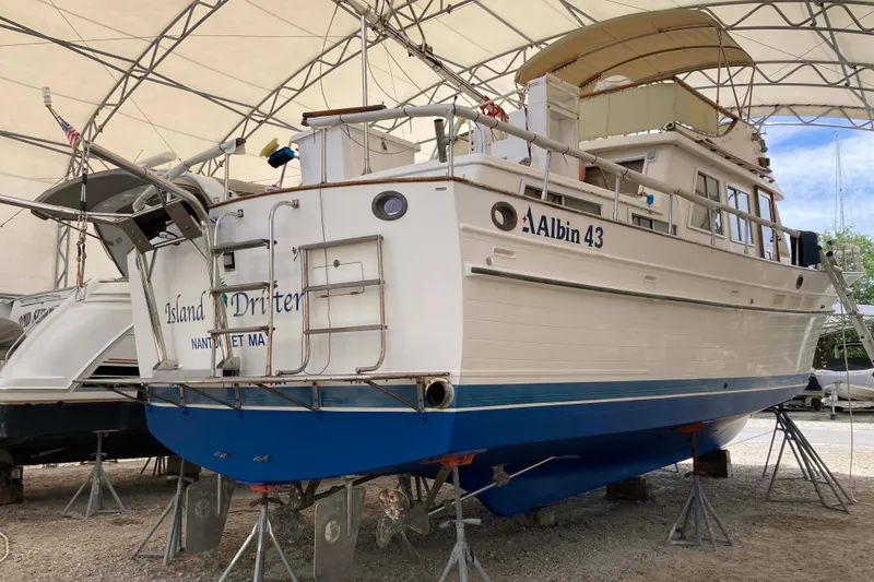 Slide: The Image of 1988 Albin 43 Trawler in dry dock, showcasing its classic design and sturdy build. - 5