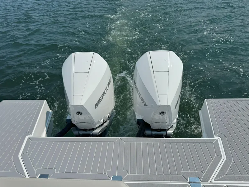 Slide: The Image of 2025 Cruisers Yachts 34 GLS Outboard with twin Mercury engines on water. - 14