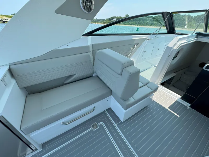 Slide: The Image of 2025 Cruisers Yachts 34 GLS Outboard interior with sleek seating and modern design. - 24