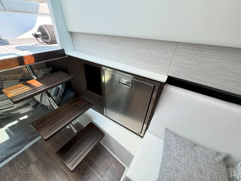 Slide: The Image of Interior of 2025 Cruisers Yachts 34 GLS Outboard, featuring sleek stairs and modern cabinetry. - 39