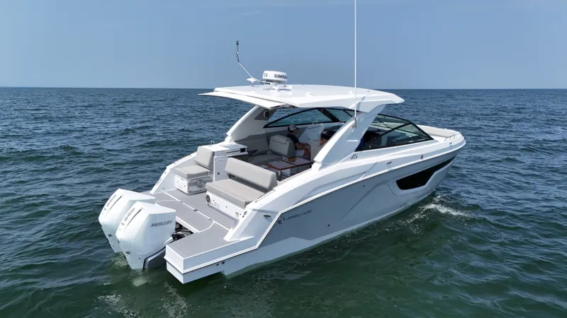 Slide: The Image of 2025 Cruisers Yachts 34 GLS Outboard on open water, showcasing sleek design and powerful engines. - 4