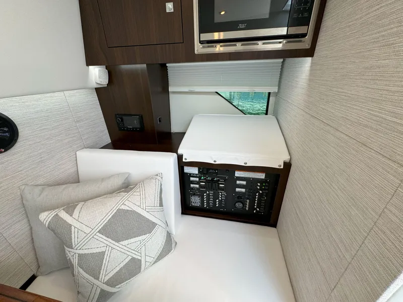 Slide: The Image of 2025 Cruisers Yachts 34 GLS Outboard interior with modern design and control panel. - 41