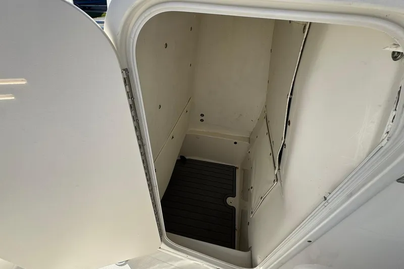 Slide: The Image of Open storage compartment on 2016 NauticStar 231 Coastal boat. - 19