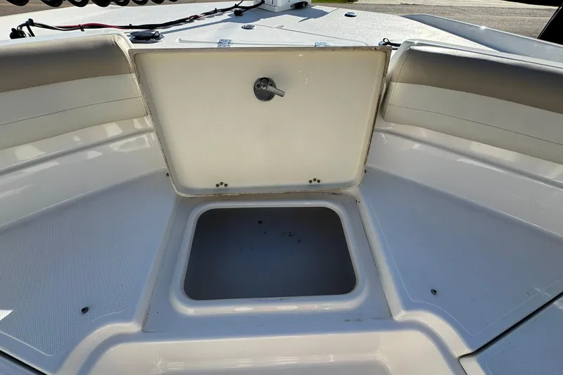 Slide: The Image of 2016 NauticStar 231 Coastal boat storage compartment with open hatch. - 25