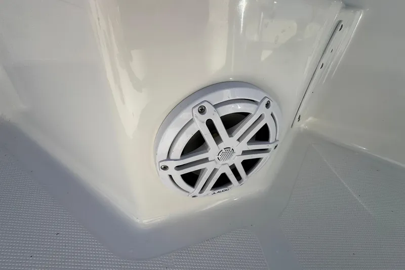 Slide: The Image of White JL Audio speaker on 2016 NauticStar 231 Coastal boat interior. - 30