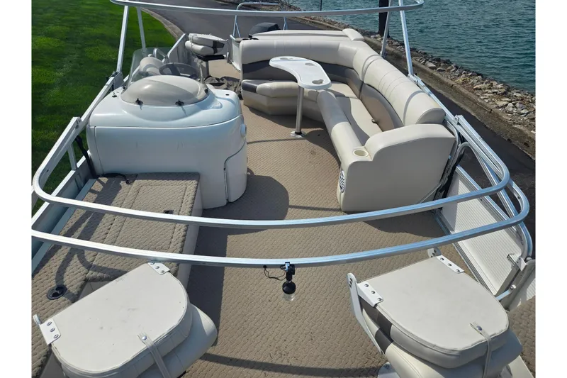 Slide: The Image of 2006 Suncruiser Trinidad 220 pontoon boat with spacious seating and lake view. - 10