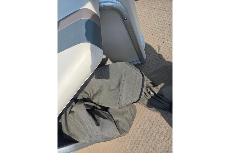 Slide: The Image of 2006 Suncruiser Trinidad 220 boat interior with folded fabric on the floor. - 18