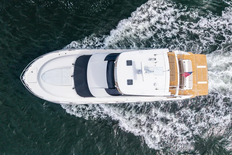 Slide: The Image of Aerial view of 2015 Tiara Yachts boat cruising on open water. - 13