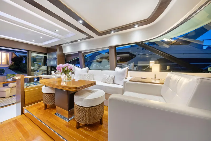 Slide: The Image of Luxurious 2015 Tiara Yachts interior with elegant seating, wooden accents, and ambient lighting. - 23