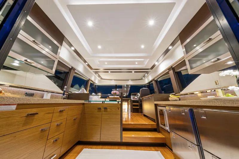 Slide: The Image of Luxurious 2015 Tiara Yachts interior with modern kitchen and elegant lighting. - 24