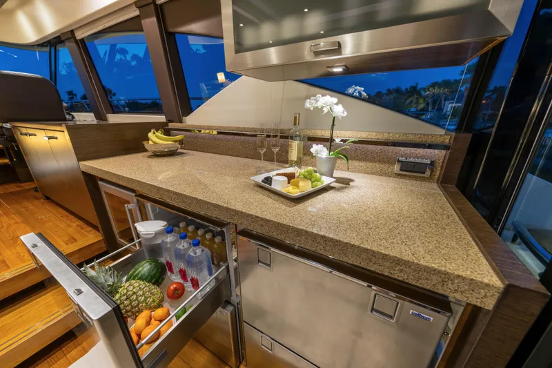 Slide: The Image of Luxurious 2015 Tiara Yachts kitchen with granite countertops and stocked refrigerator drawer. - 26
