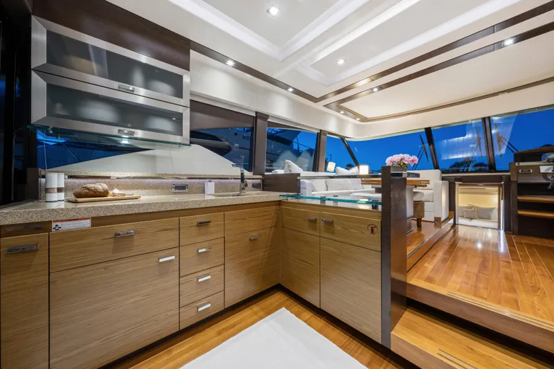 Slide: The Image of Luxurious 2015 Tiara Yachts interior with modern kitchen and elegant dining area. - 27