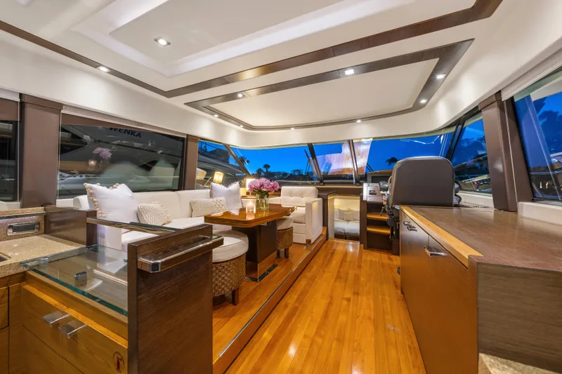Slide: The Image of Luxurious 2015 Tiara Yachts interior with elegant seating, wooden flooring, and modern design. - 28