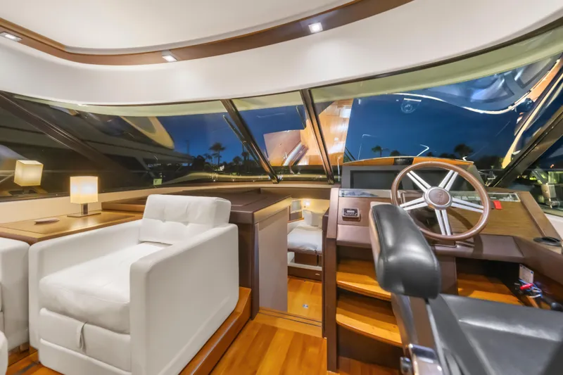 Slide: The Image of Luxurious 2015 Tiara Yachts interior with plush seating and elegant helm station. - 29
