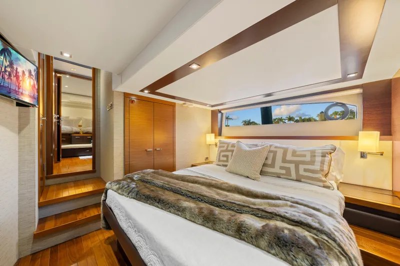 Slide: The Image of Luxurious 2015 Tiara Yachts bedroom interior with elegant decor and scenic window view. - 32