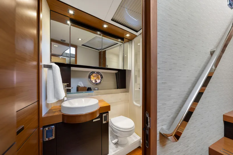Slide: The Image of Luxurious 2015 Tiara Yachts bathroom with modern fixtures and elegant wood accents. - 38