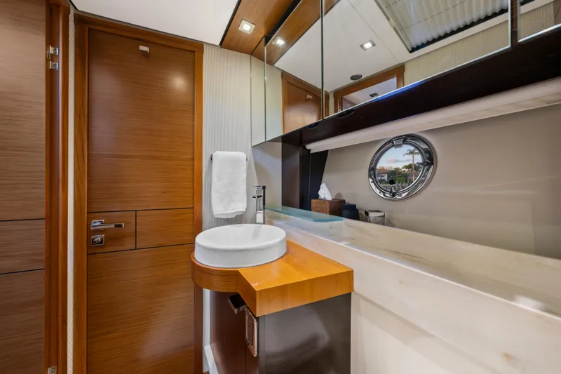 Slide: The Image of Luxurious 2015 Tiara Yachts bathroom with modern fixtures and wooden accents. - 40