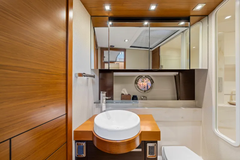 Slide: The Image of Luxurious 2015 Tiara Yachts bathroom with modern wood accents and sleek fixtures. - 41