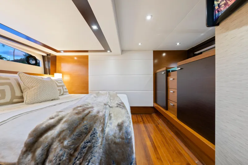 Slide: The Image of Luxurious 2015 Tiara Yachts bedroom interior with modern design and elegant wood finishes. - 43