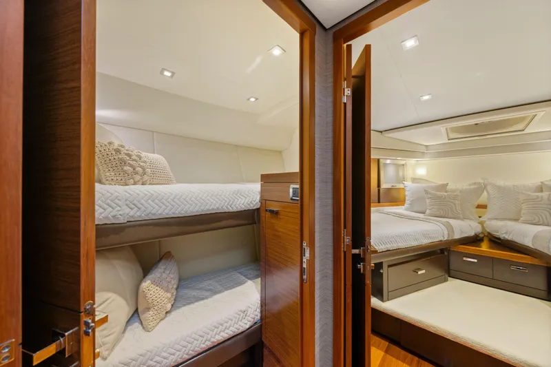 Slide: The Image of Luxurious 2015 Tiara Yachts interior with cozy bunk beds and elegant double bed. - 50