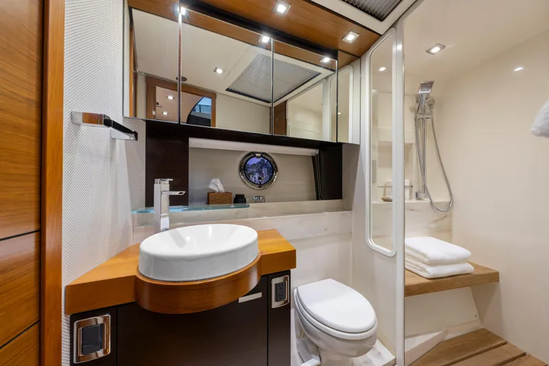 Slide: The Image of Luxurious 2015 Tiara Yachts bathroom with modern fixtures, wooden accents, and elegant design. - 53