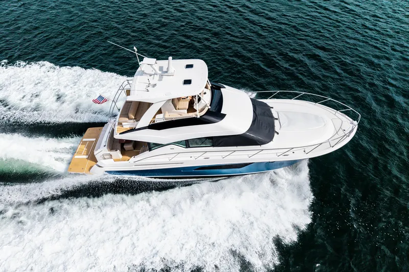 Slide: The Image of Aerial view of 2015 Tiara Yachts cruising on open water. - 6