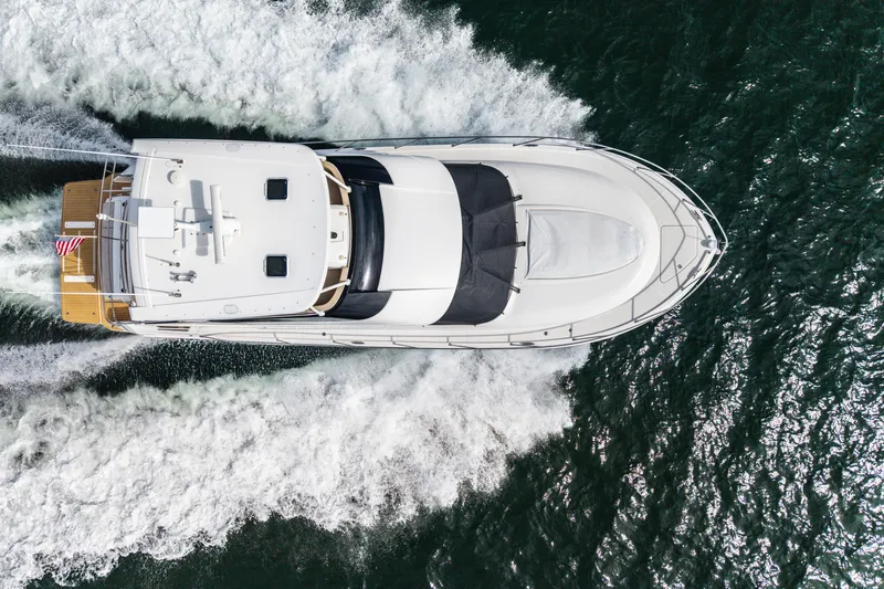 Slide: The Image of Aerial view of a 2015 Tiara Yachts boat cruising on the water. - 7