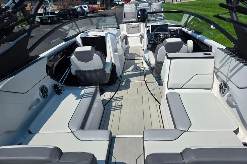 Slide: The Image of 2023 Yamaha Boats 252XE interior with modern seating and sleek design. - 10