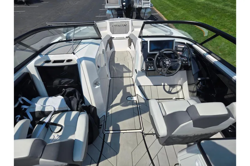 Slide: The Image of 2023 Yamaha Boats 252XE interior with modern dashboard and seating. - 11