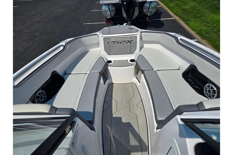 Slide: The Image of 2023 Yamaha Boats 252XE interior with spacious seating and modern design. - 18